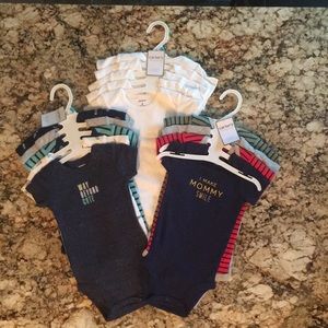 A bundle of brand new Carter’s Onesies size 6 mo